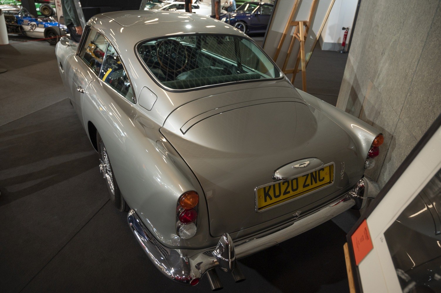Vintage luxury coupe rear with rounded tail and chrome bumpers