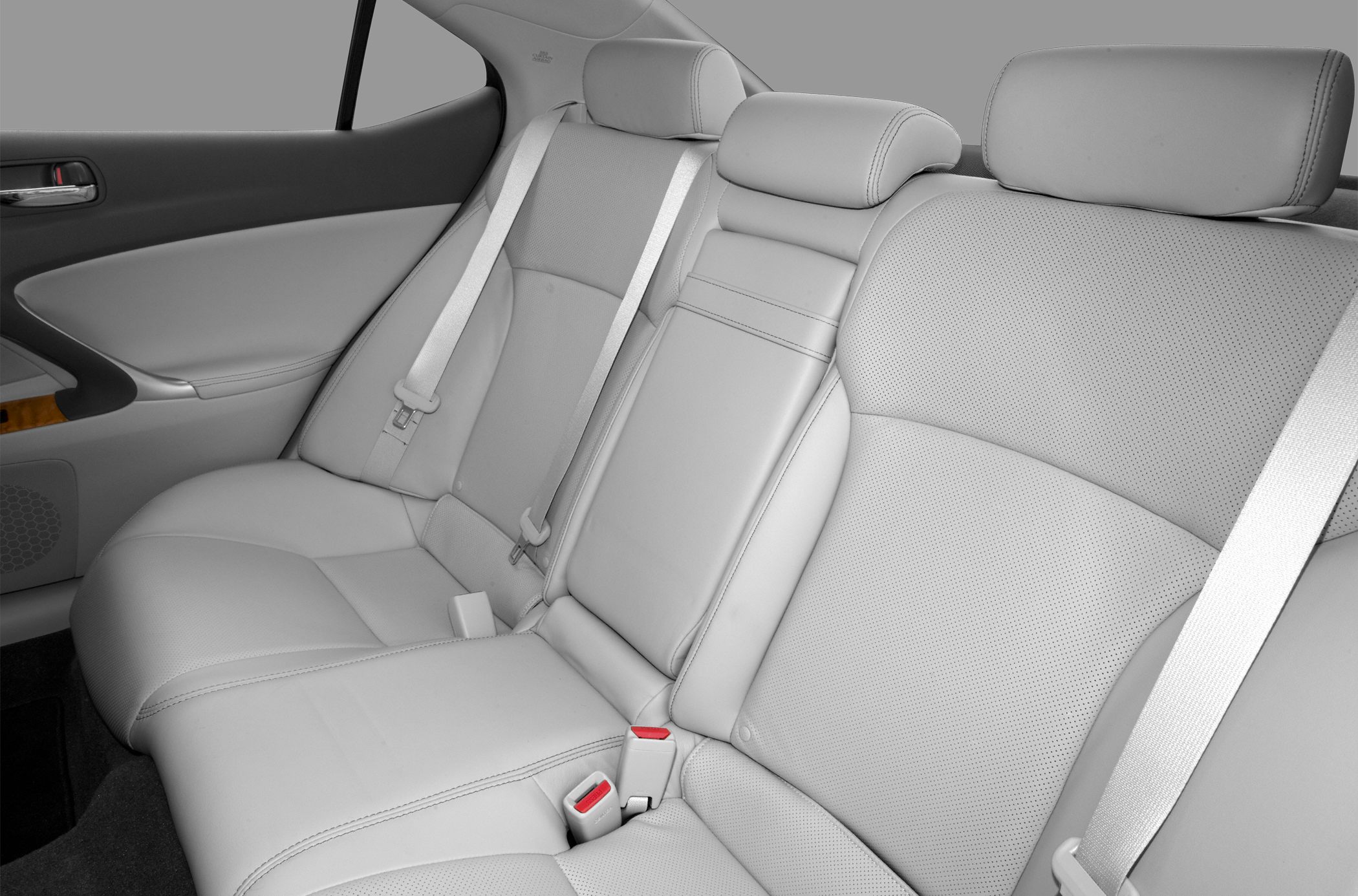 Rear seats with leather upholstery, seatbelts, and headrests