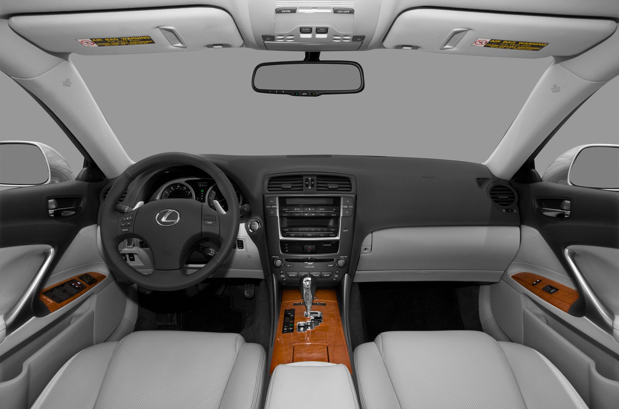 Interior view showing dashboard, steering wheel, center console with wood trim