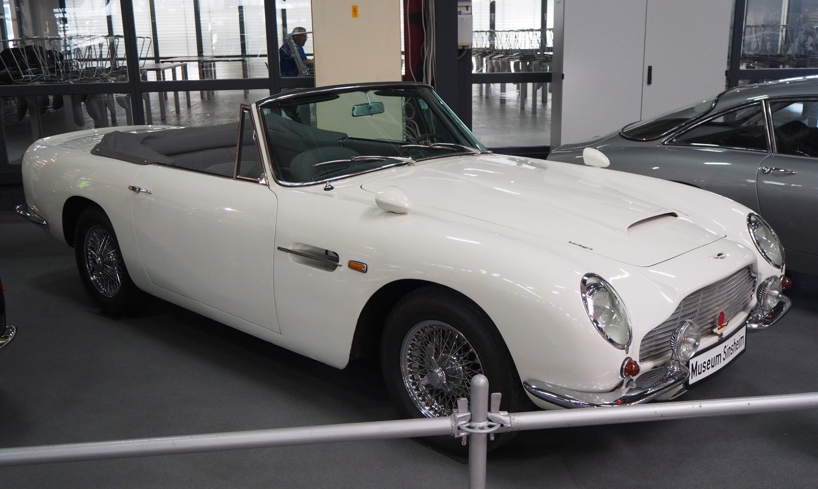 White convertible with wire wheels and chrome bumper