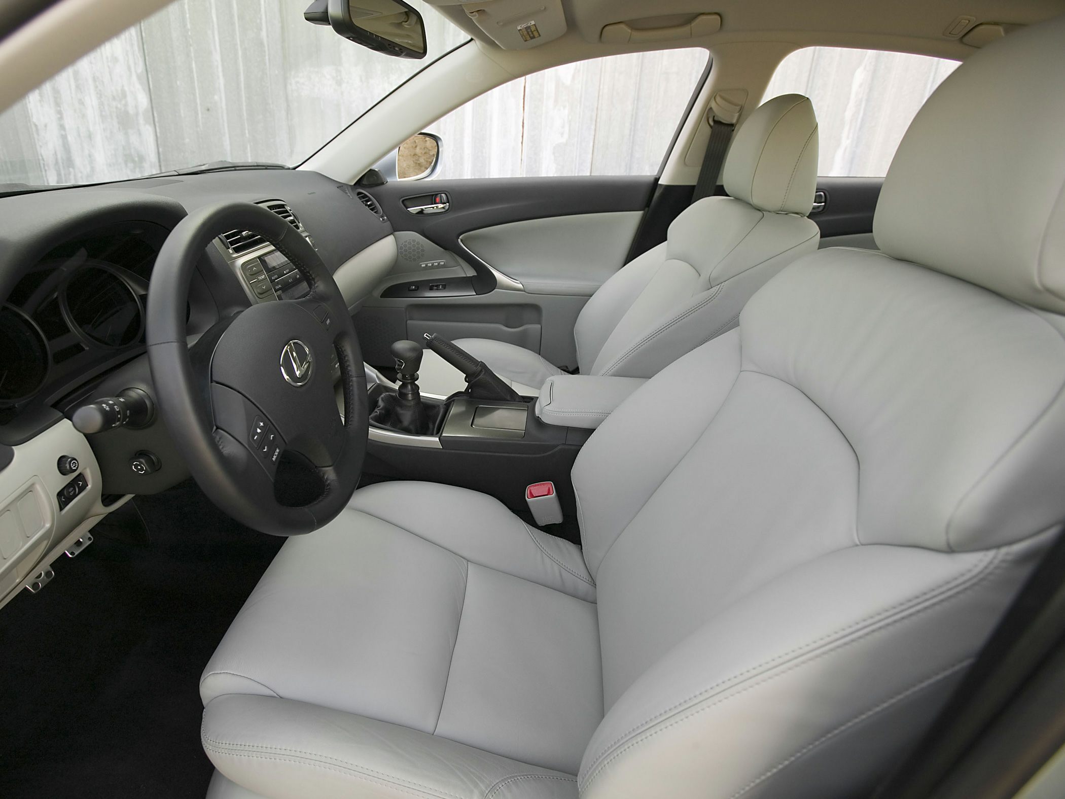 Grey leather seats and manual gearstick in car interior