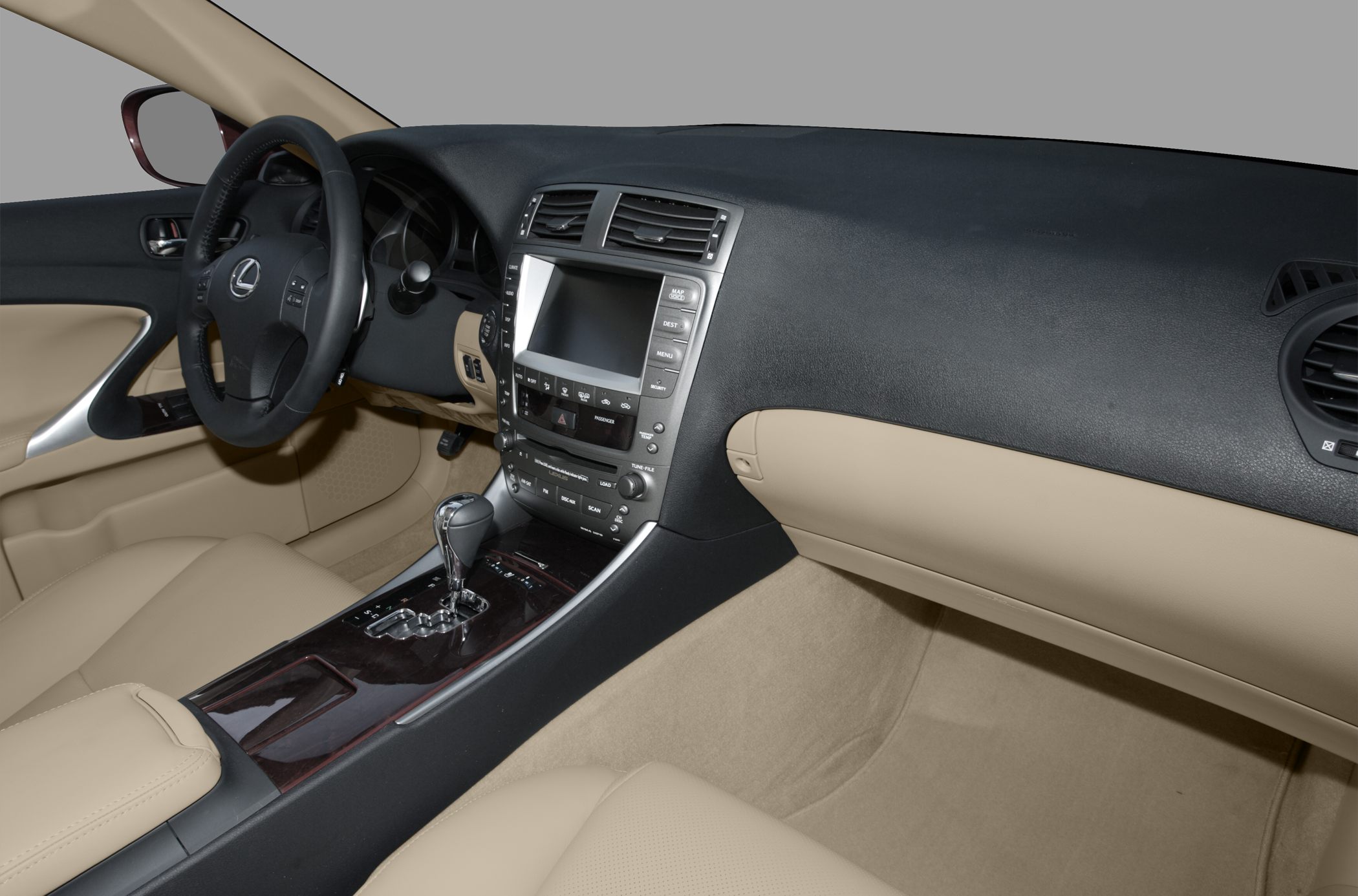 Beige interior with dashboard and central console featuring gear shift and navigation display