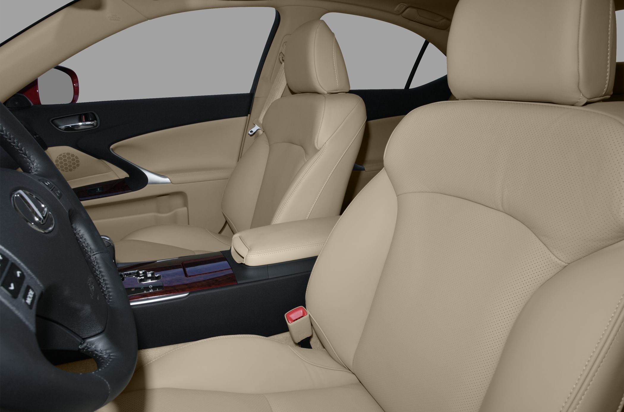 Beige leather front seats with black dashboard and wood trim