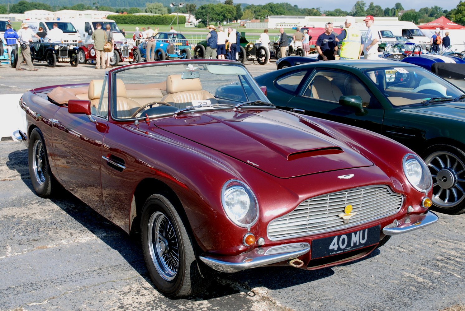 Classic convertible with prominent front grille and beige leather seats