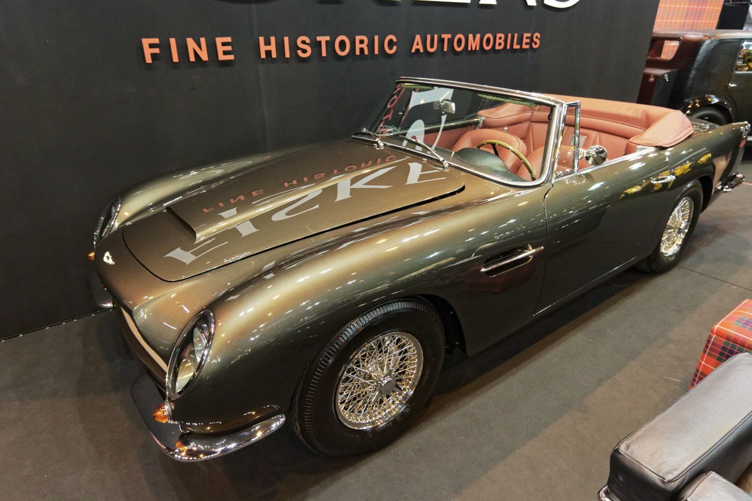 Vintage convertible with wire wheels and open-top design