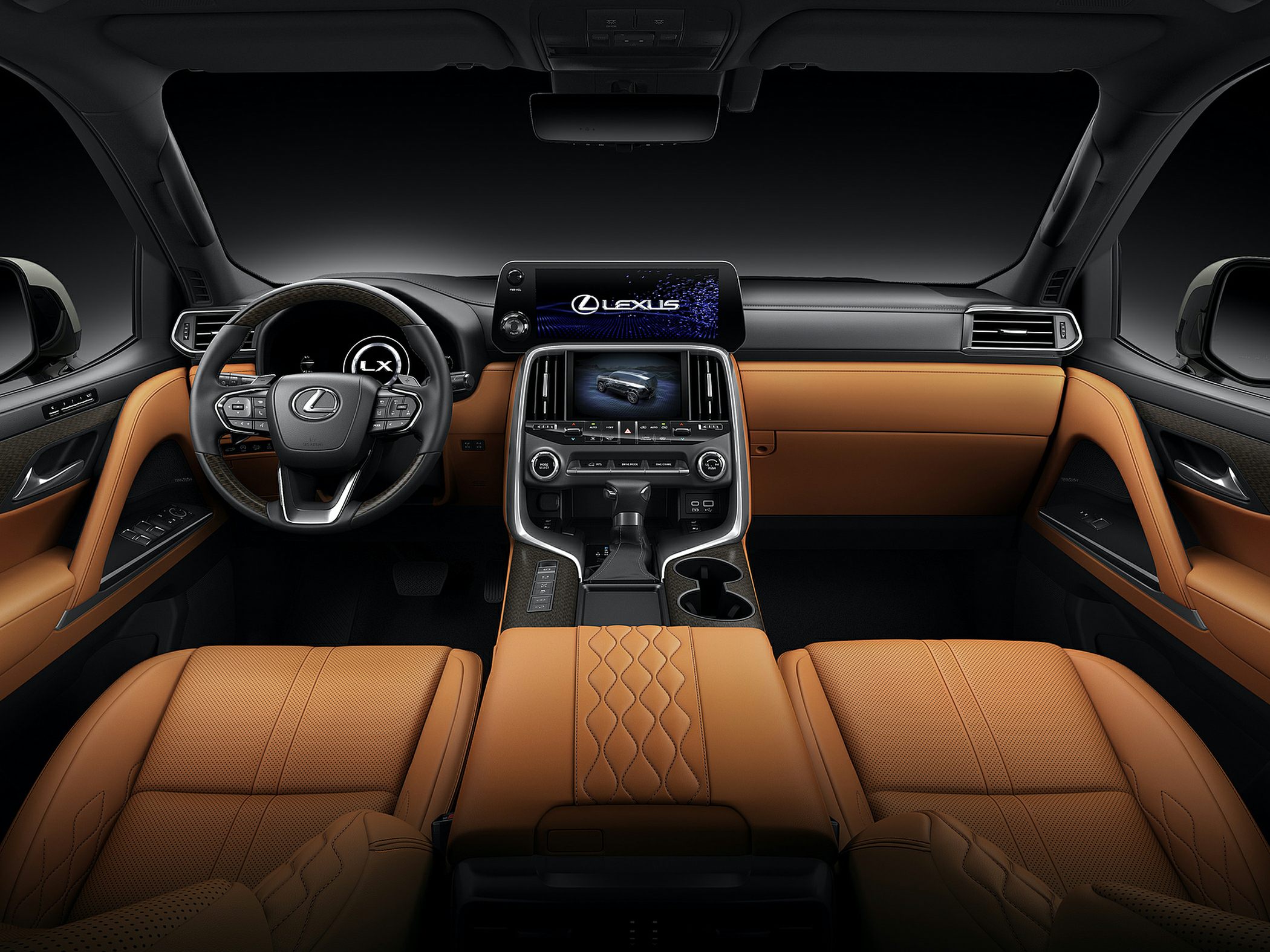 Luxury interior with dual digital displays and tan leather upholstery