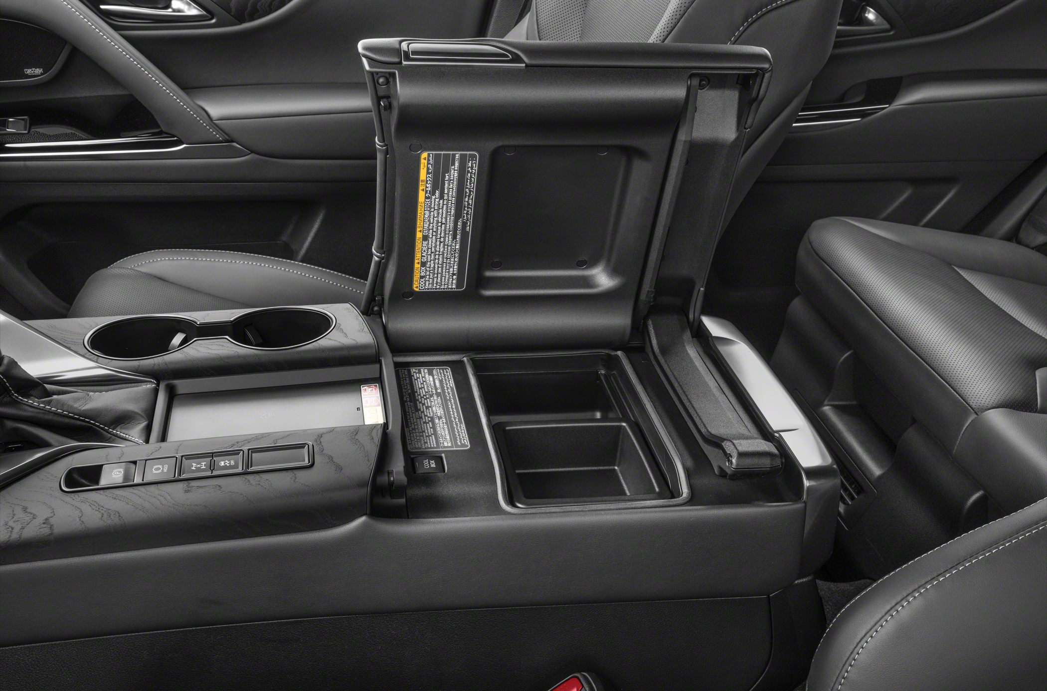 Center console with storage compartment and cup holders in car interior