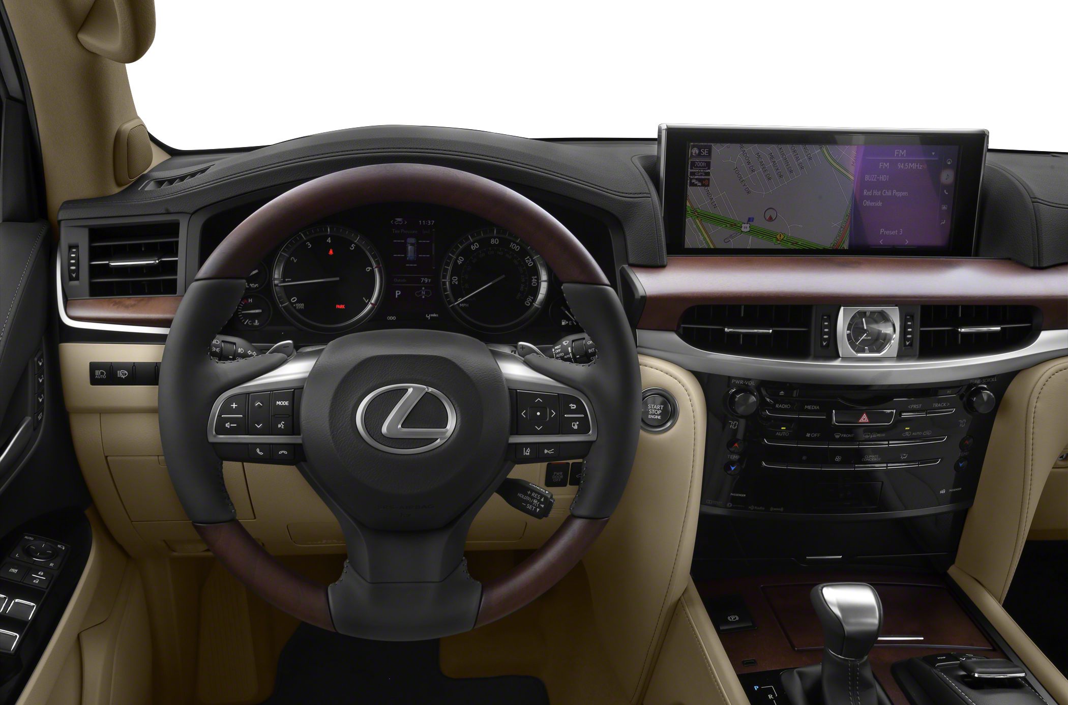 Steering wheel with control buttons, digital instrument cluster, infotainment screen, gear shifter