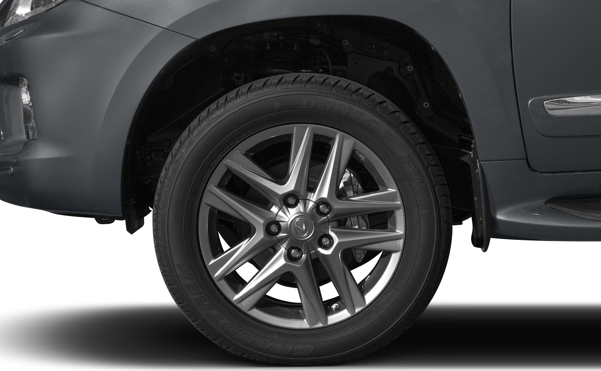 Multi-spoke alloy wheel and Dunlop Grandtrek tire close-up