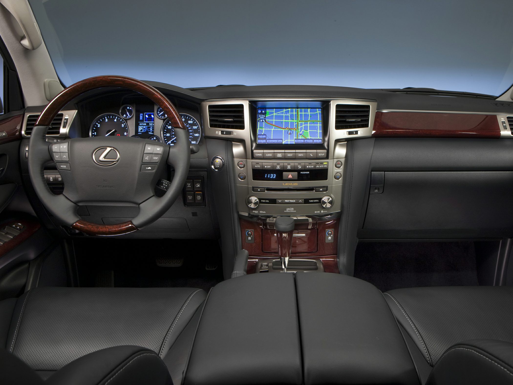 Luxury SUV dashboard with wood trim and navigation system