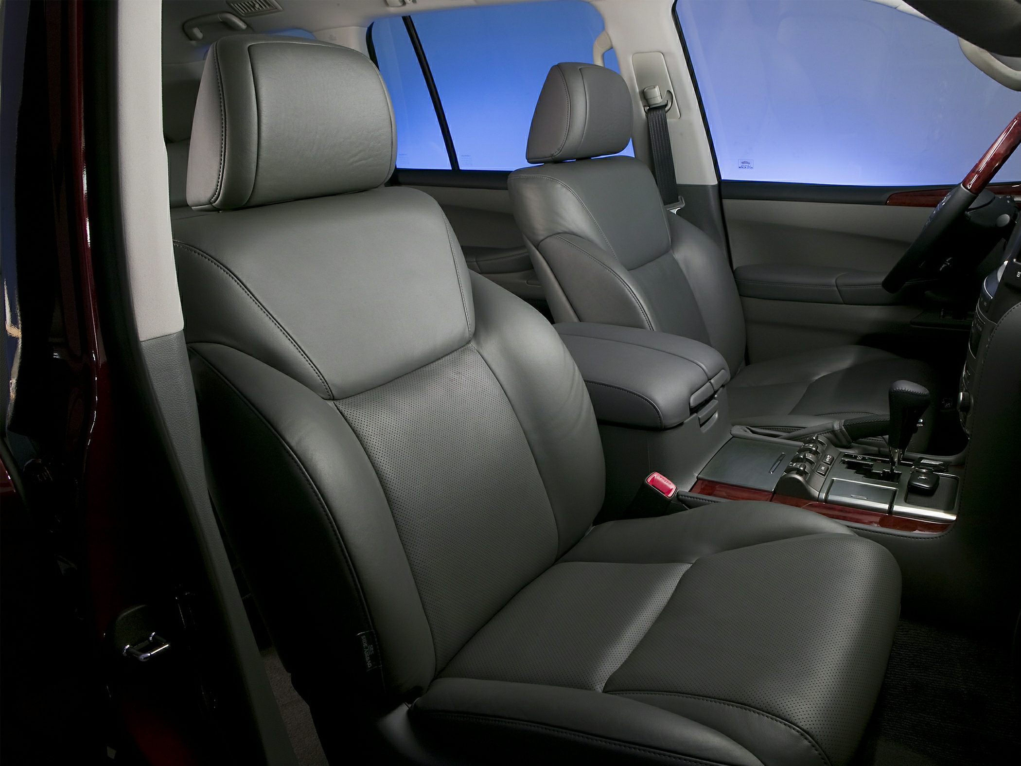 Luxury leather front seats with wood-trimmed center console