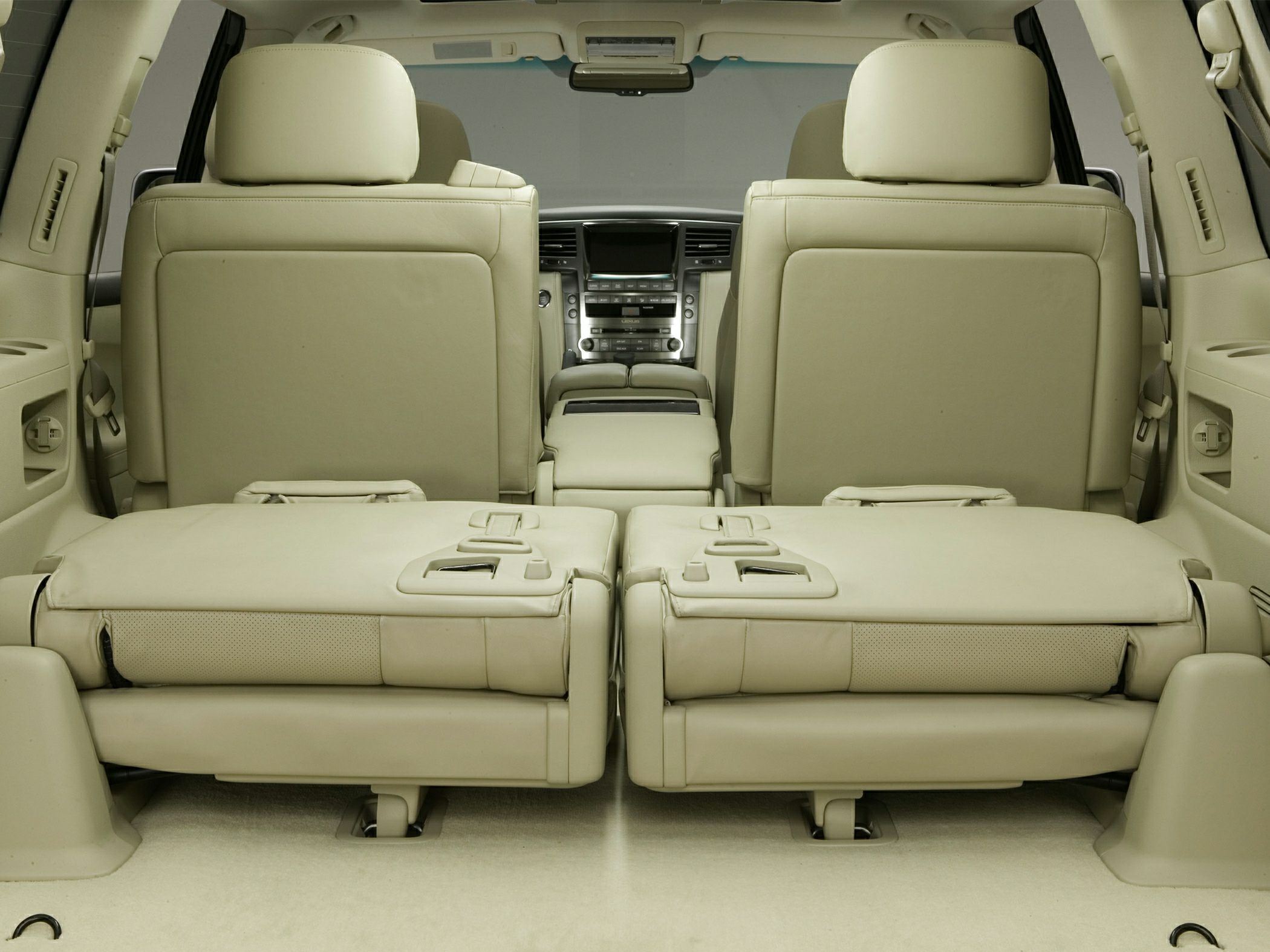 Beige leather seats with folded rear seats and spacious SUV interior