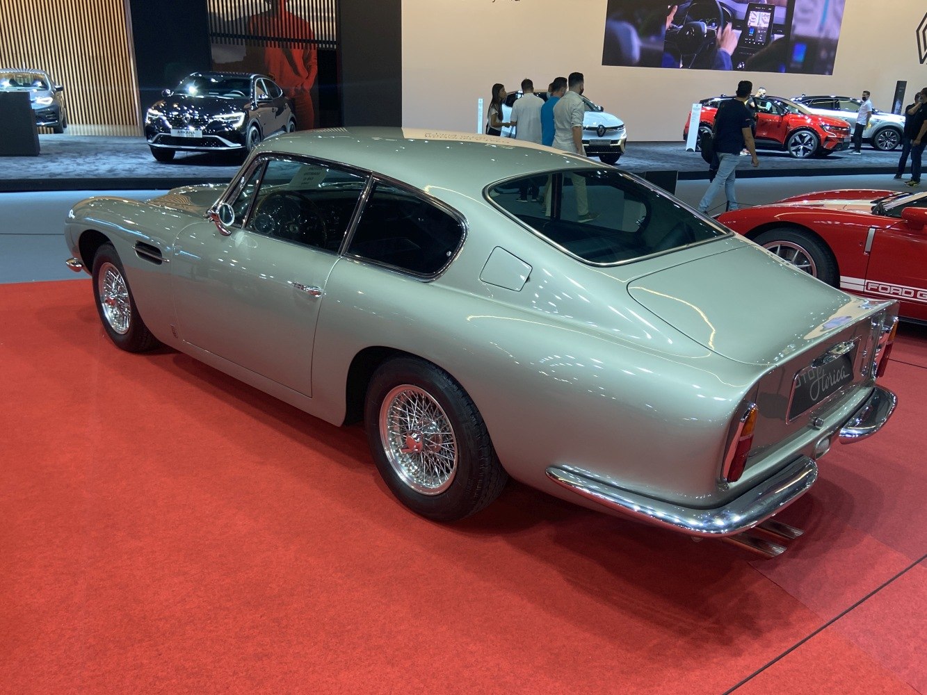 Vintage coupe with wire wheels and smooth, curved rear design.