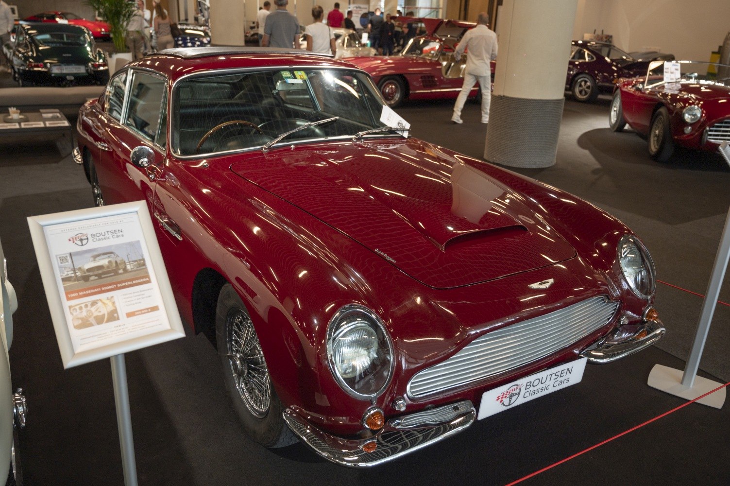 Vintage 1960s coupe with wire-spoked wheels and classic front grille
