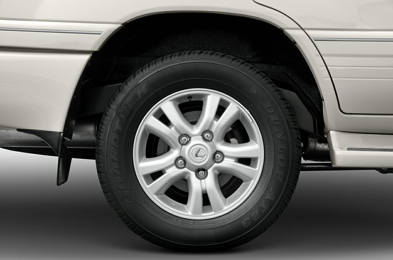 Alloy wheel with Dunlop tire on an SUV side view