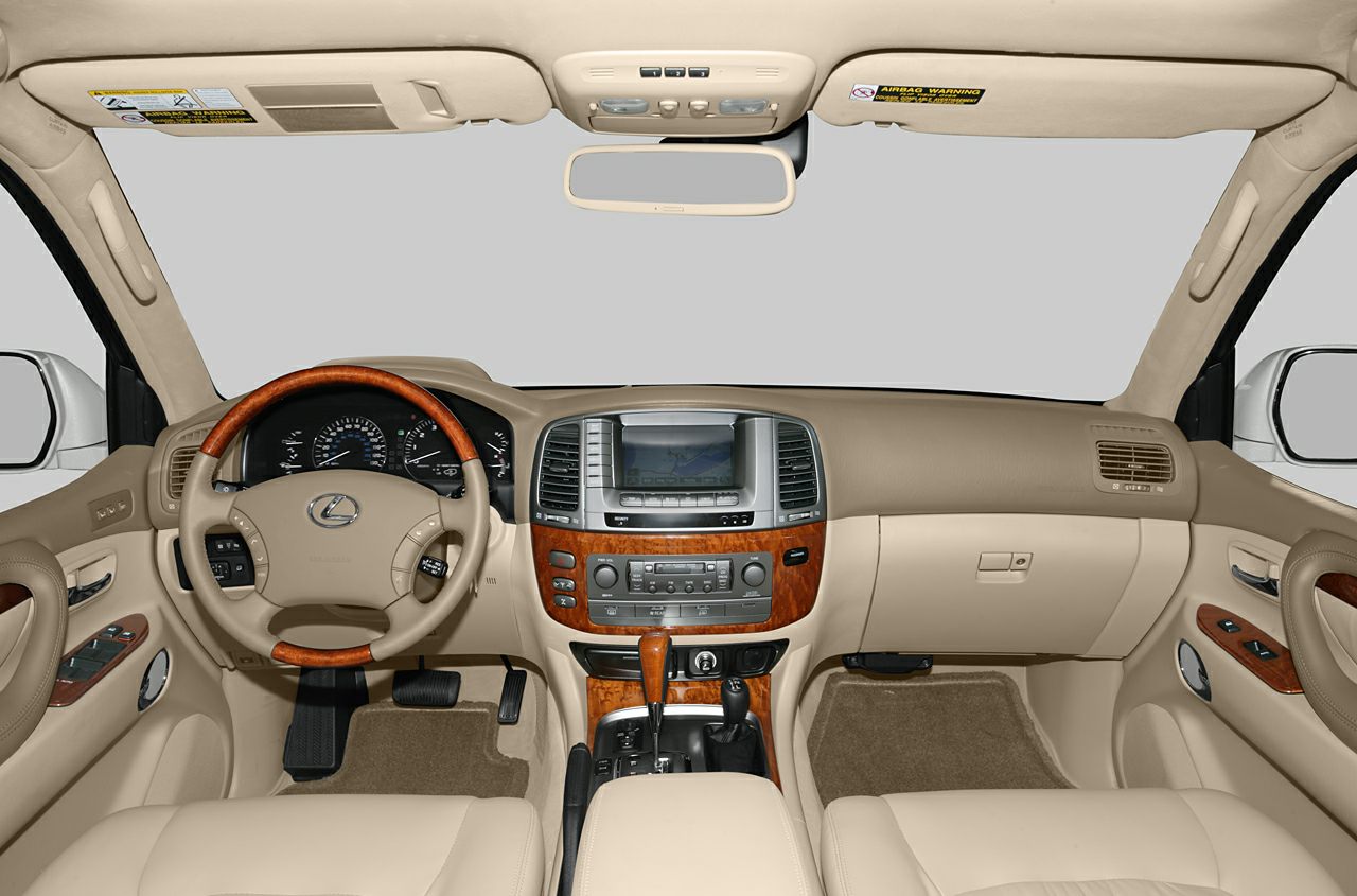 Beige leather interior with wood trim dashboard and multifunction steering wheel