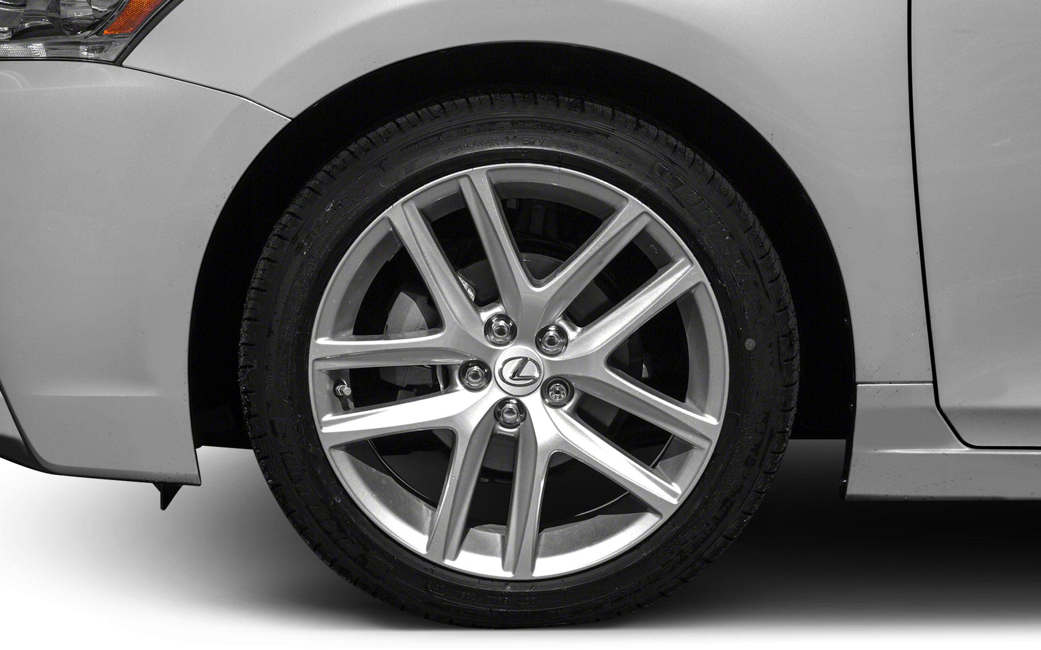 Stylish alloy wheel with multi-spoke rim design and tire close-up.