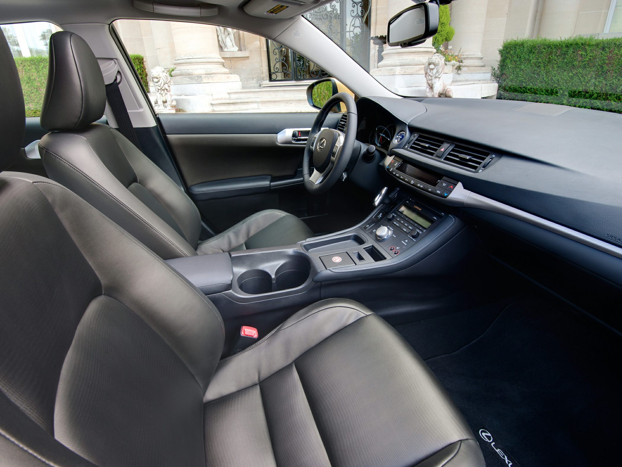 Modern Lexus car interior with leather seats and detailed dashboard center console