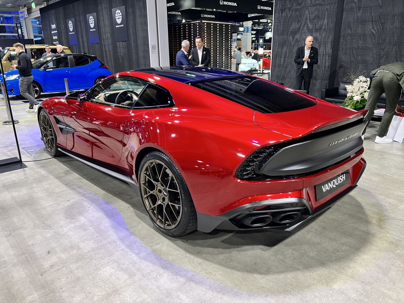 Sporty rear and side view with quad exhaust and aerodynamic curves
