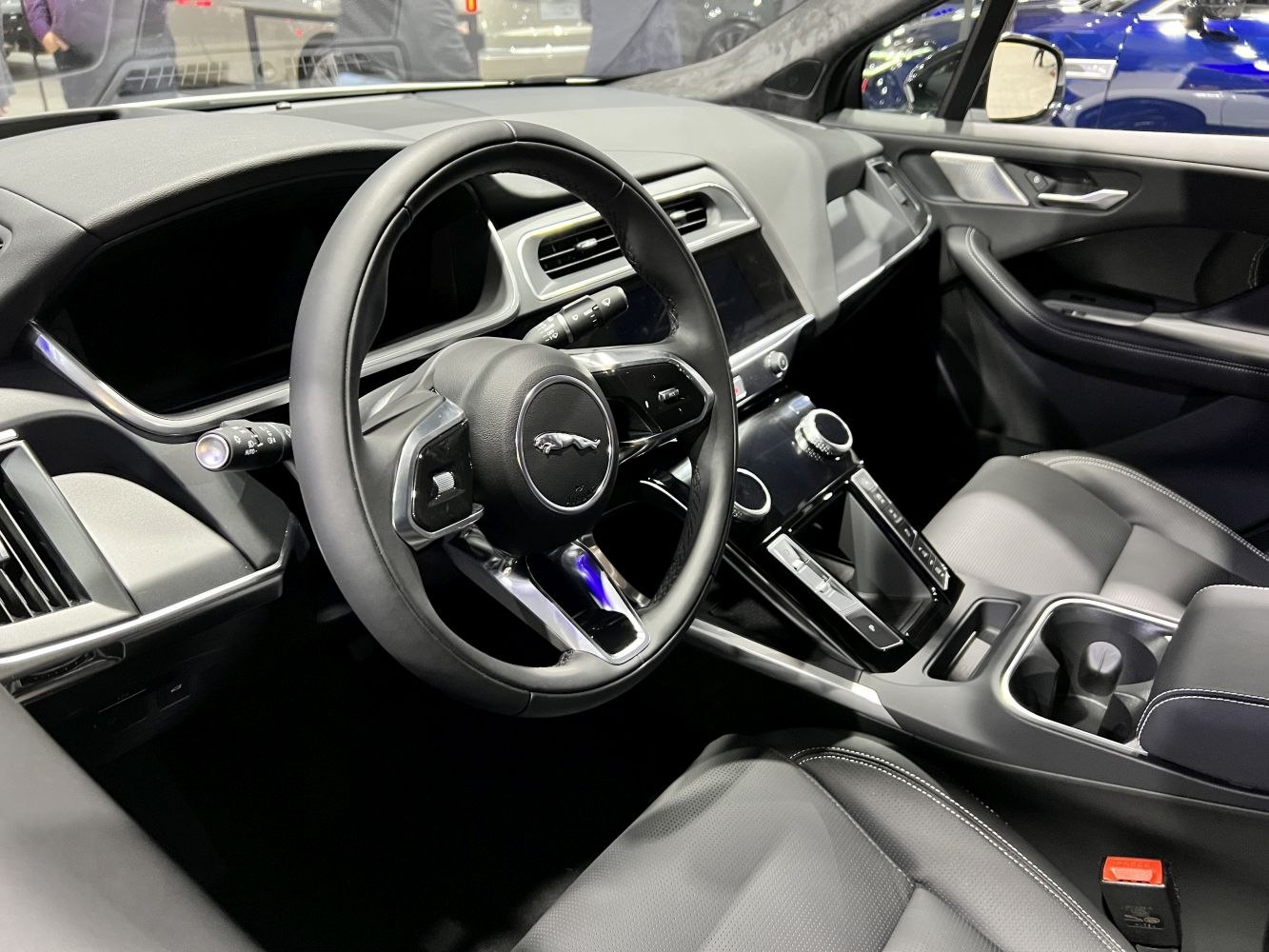 Luxury electric SUV steering wheel and modern interior dash design