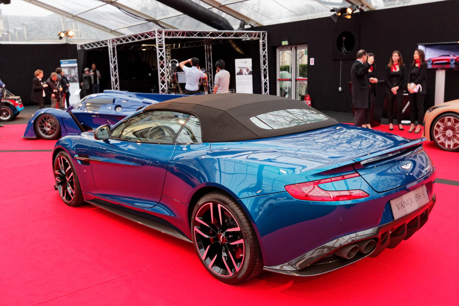Rear view of convertible with soft top and quad exhausts