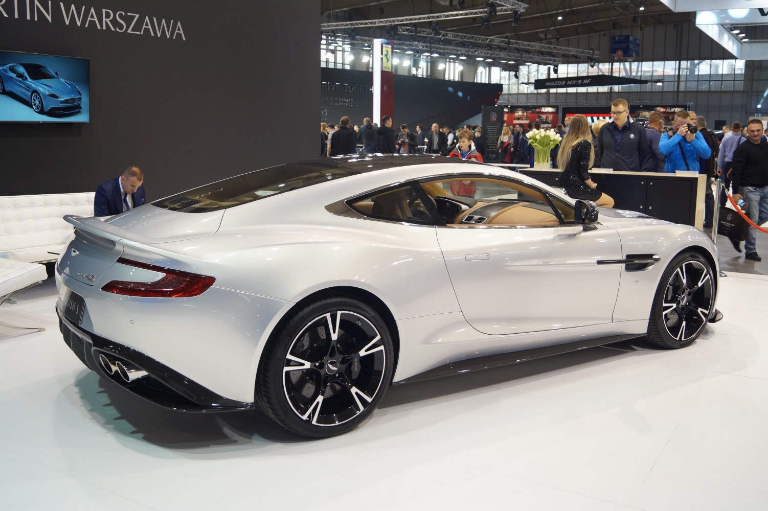 Rear side view with aerodynamic lines and distinctive alloy wheels