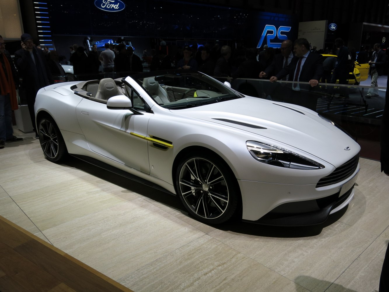 White convertible sports car with aerodynamic design and alloy wheels