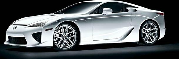 Aerodynamic side profile of a silver mid-engine sports coupe with distinctive alloy wheels.