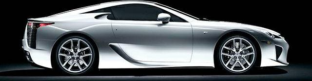 Sleek silver side profile of a high-performance sports supercar.