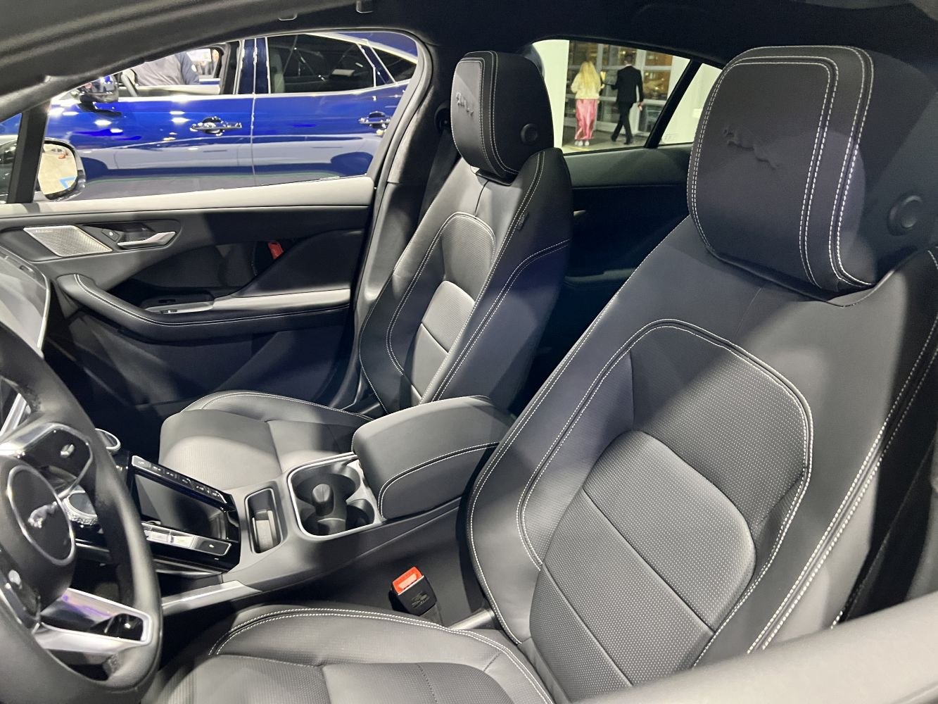 Luxury leather seats with detailed stitching and modern central console