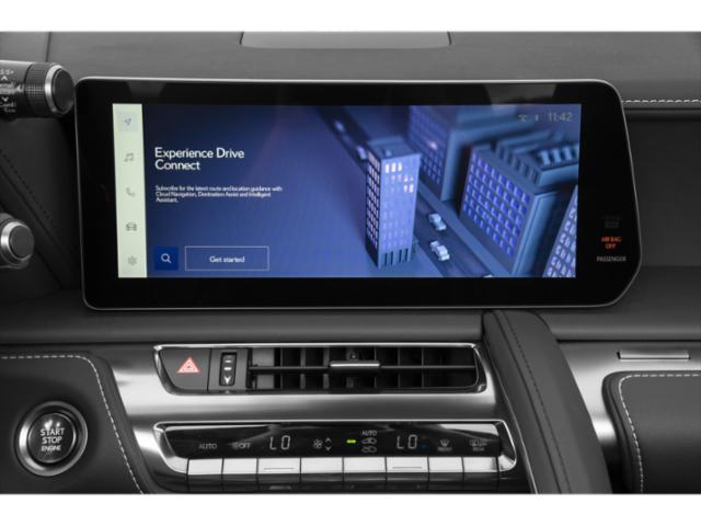 Digital touchscreen infotainment display with climate and navigation controls.