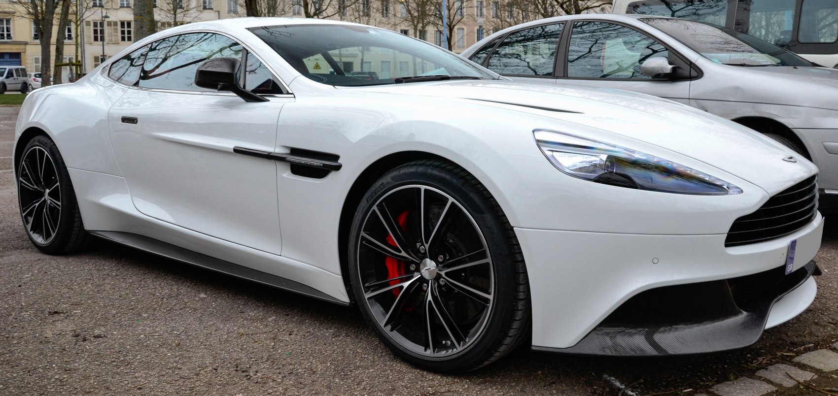 White sports coupe with sleek body and alloy wheels