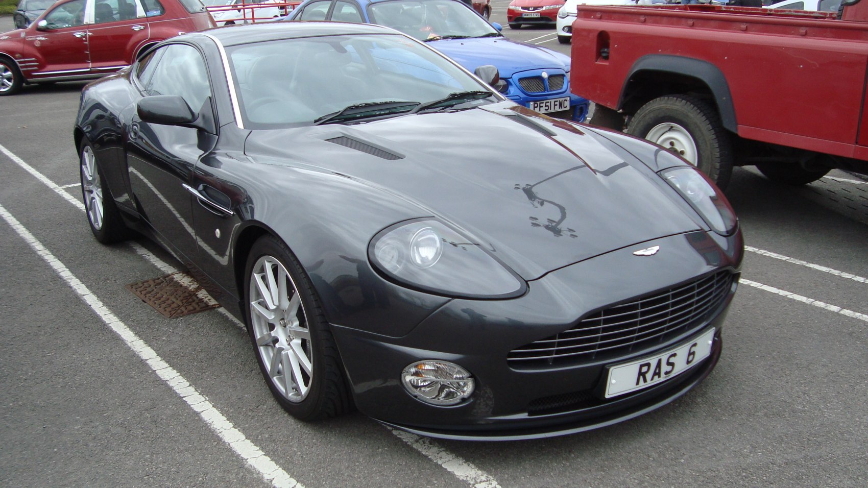 Front three-quarter view showcasing sleek design and distinctive grille