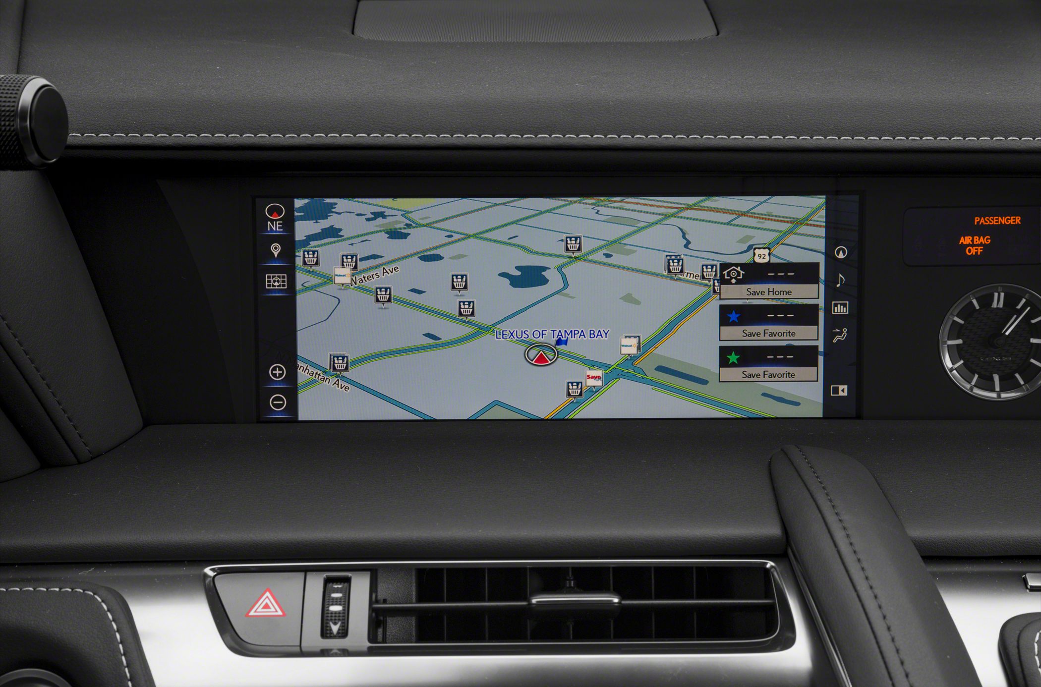 In-car navigation screen with map display and dashboard controls.