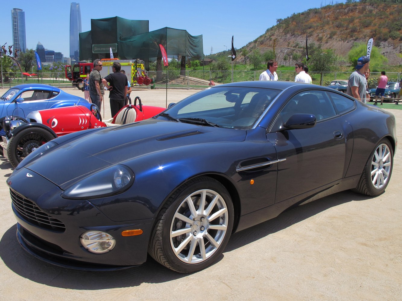 Dark coupe with aerodynamic body and alloy wheels