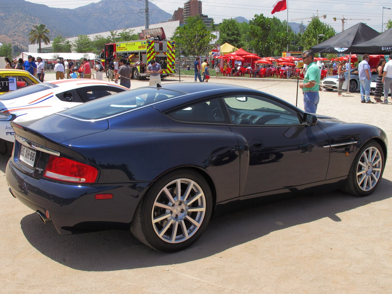 Rear and side profile of sleek luxury coupe with alloy wheels