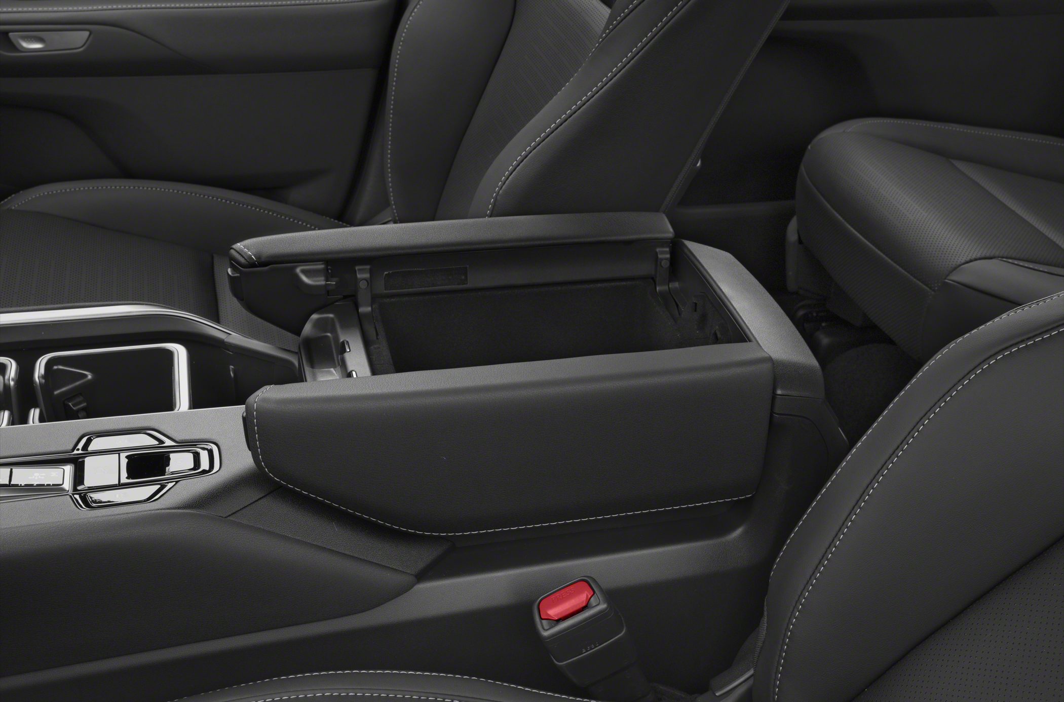 Open center console storage and padded armrest with contrast stitching