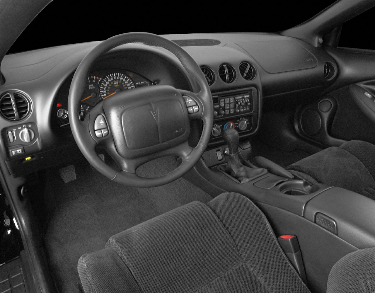Dashboard and steering wheel with analog speedometer and automatic gear shift