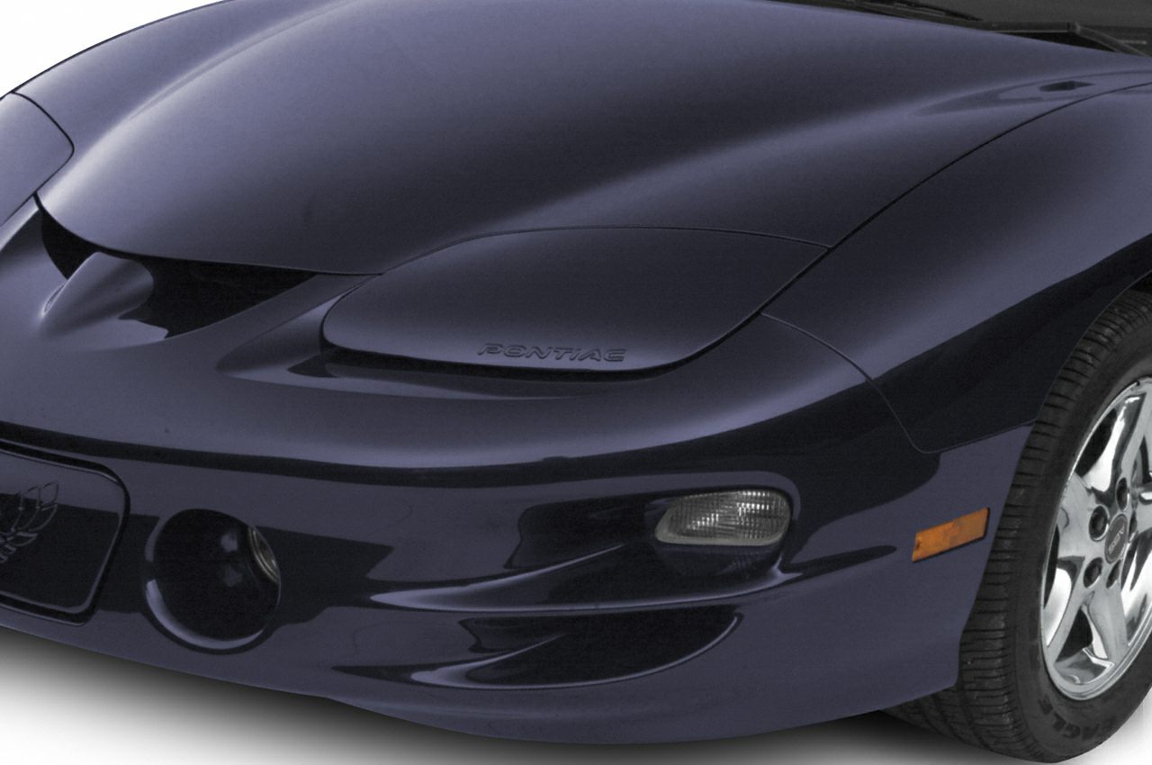 Close-up of front hood and pop-up headlight on sleek vehicle front end