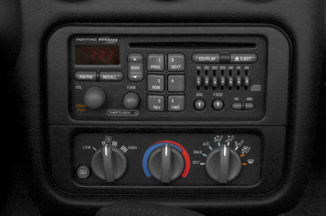 Classic car radio and manual climate controls in vehicle interior