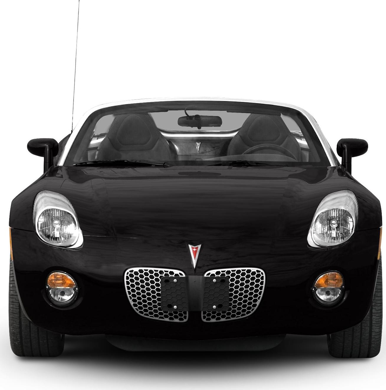 Front view of a sports convertible with honeycomb grille and dual headlights.