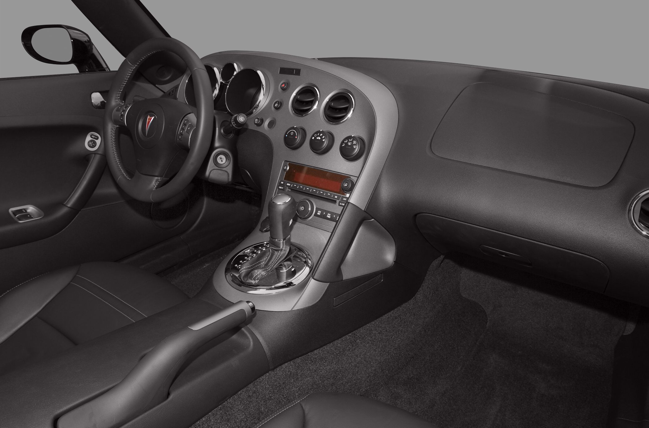 Dashboard and steering wheel with center console and controls