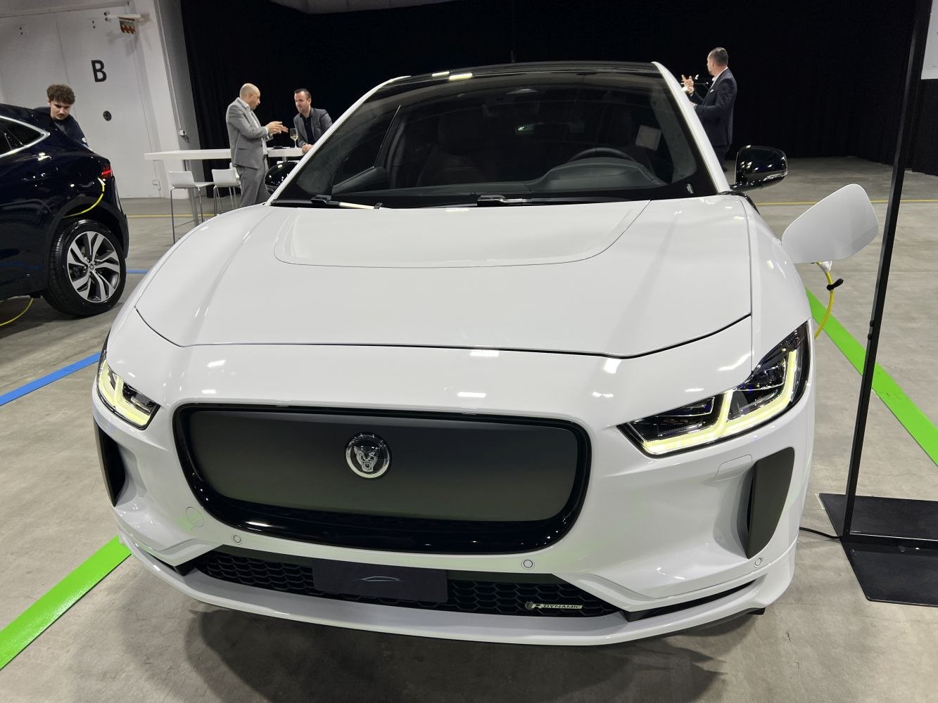 Front view with LED headlights and sleek grille of a white vehicle
