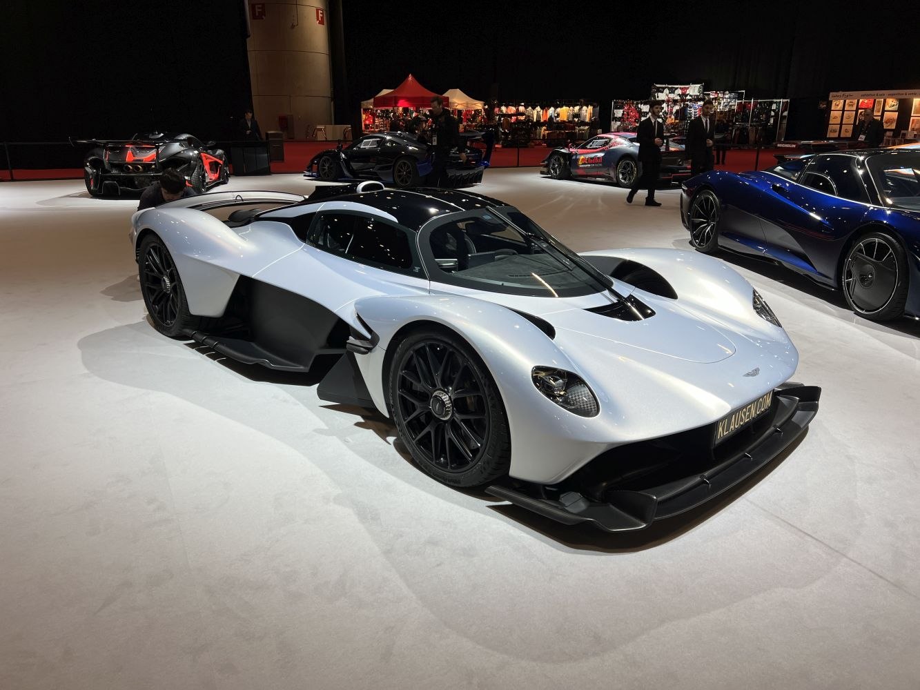Sleek white hypercar with aerodynamic body and aggressive styling