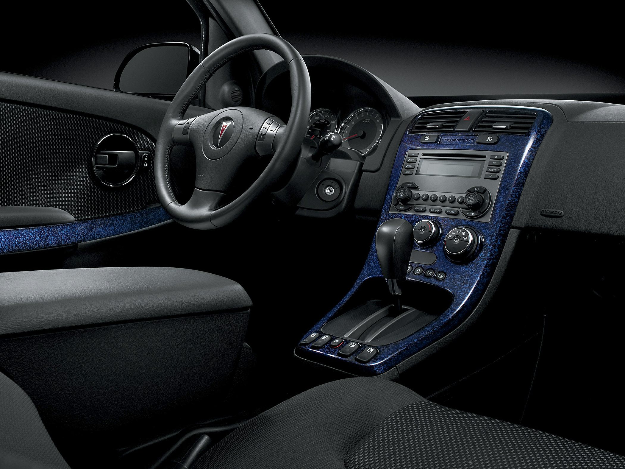 Dashboard and steering wheel with center console and controls