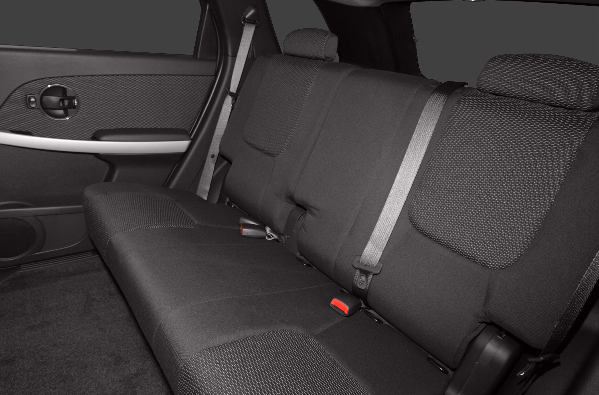 Rear seat interior with fabric upholstery, headrests, and seat belts