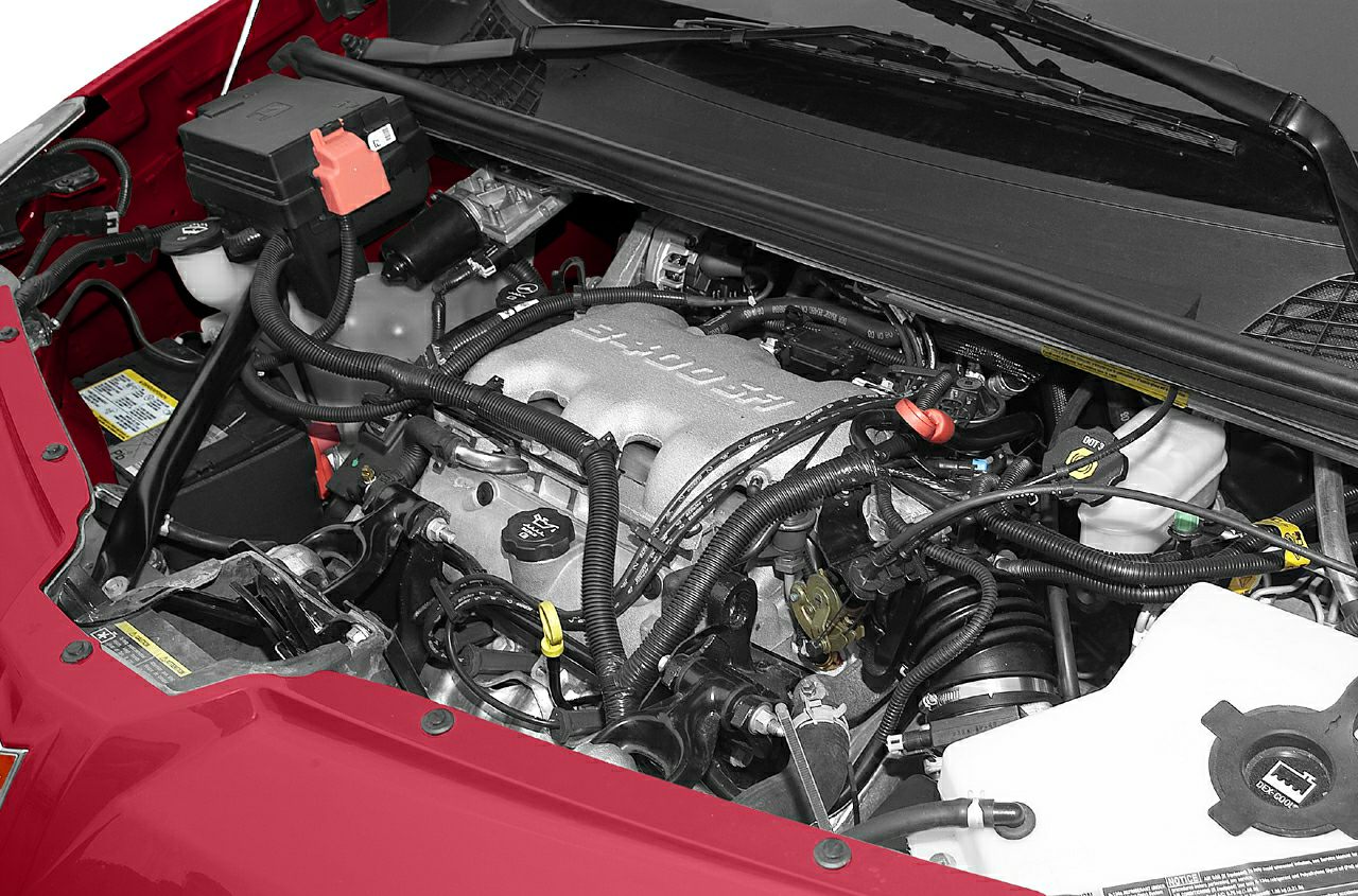 Close-up of engine bay with V6 engine and wiring