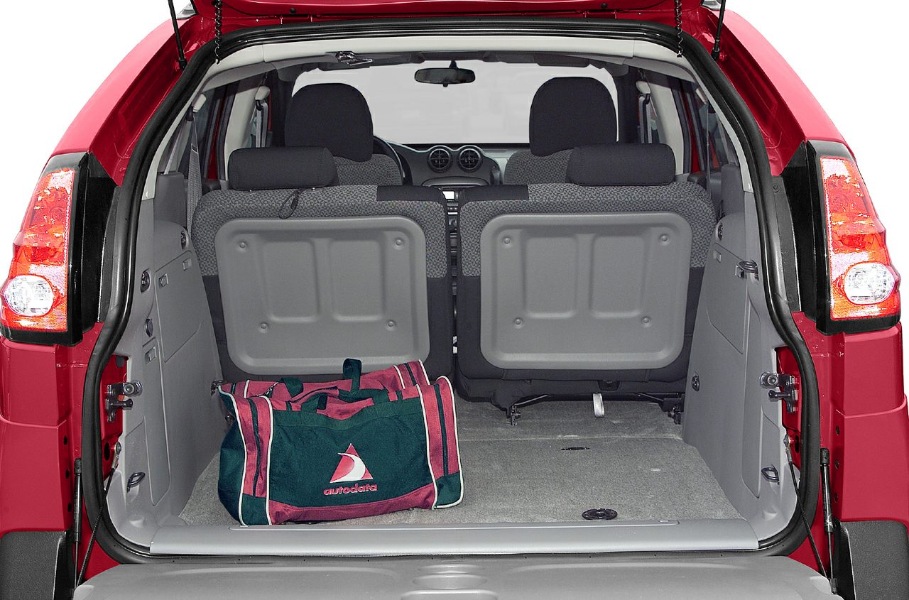 Rear cargo area and seatback design with a gym bag
