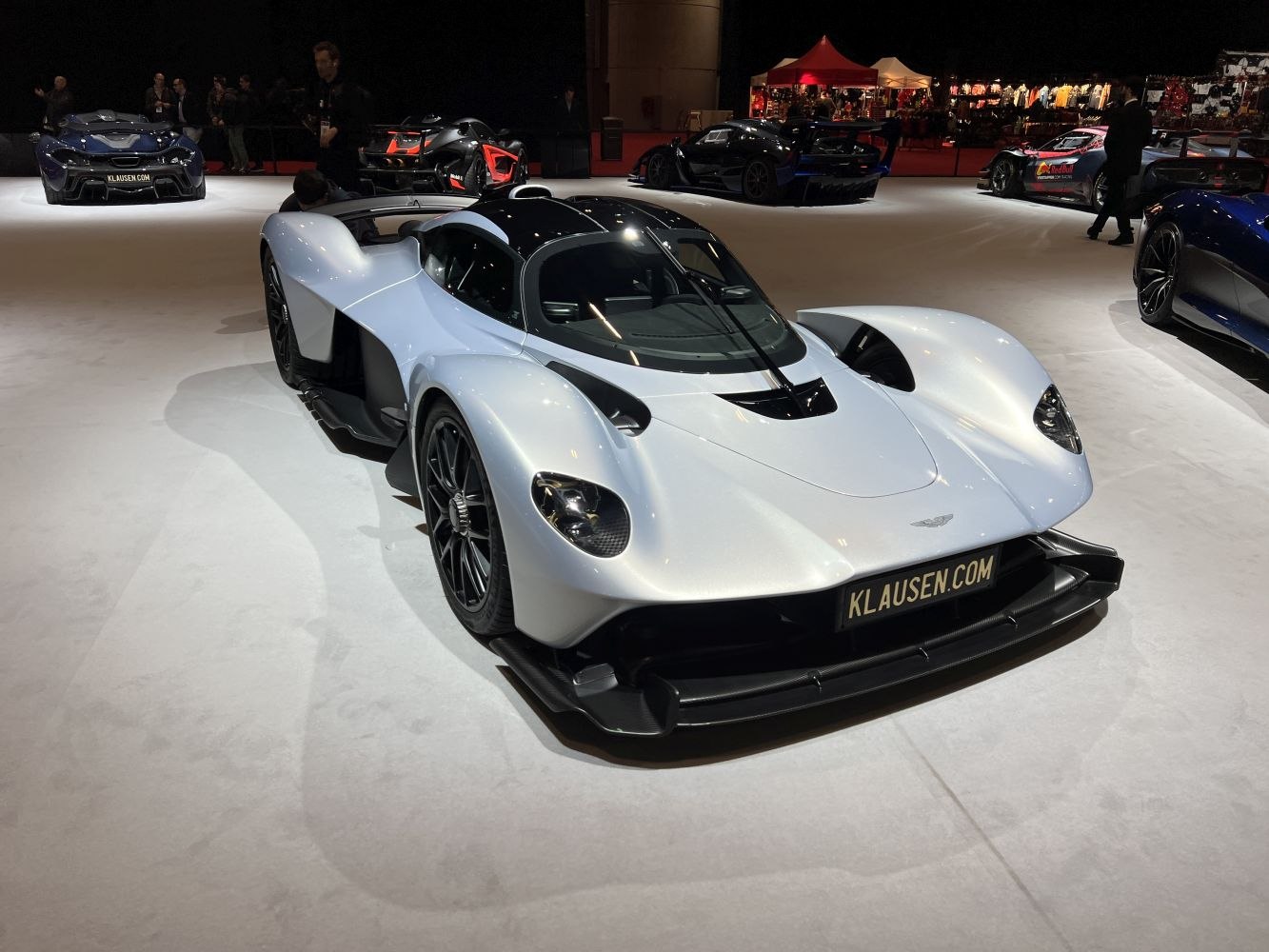 Aerodynamic hypercar front with sleek headlights and low front splitter.