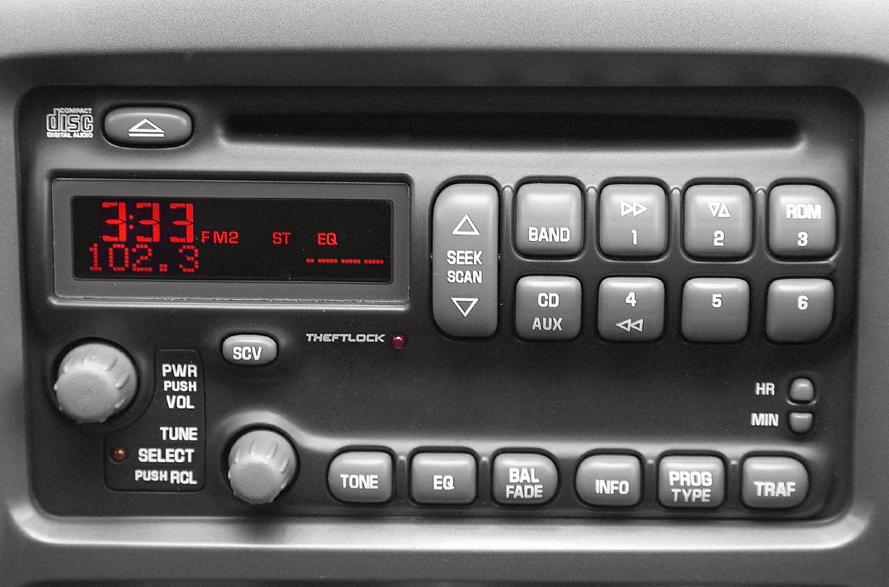 Car radio stereo system with digital display and CD player buttons